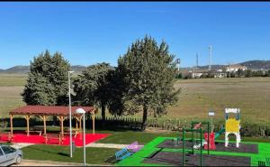 a park with a playground with a gazebo at Posada de la plata in Valdesalor