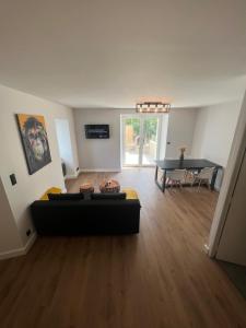 a living room with a couch and a table at Agréable T2 idéalement situé in Mende
