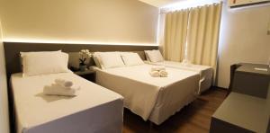 Safa Hotel Foz客房内的一张或多张床位
