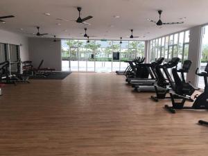 a gym with a row of treadmills in a room at Alanis D'semporna Homestay in Sepang