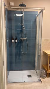 a shower with a glass door in a bathroom at Casa Franciacorta in Gussago