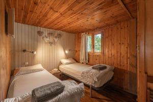 A bed or beds in a room at Camping Susen