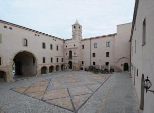 a large building with a clock tower on top of it at STELLA appartamento in Policoro