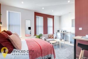 a bedroom with a bed and a living room at SCA - Entertaining Studio - CR6 in Birmingham