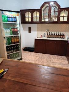 a refrigerator filled with lots of bottles of beer at Viking Villa in Kalagedihena