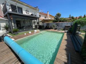 a swimming pool in the yard of a house at Relaxation AquatiqueGarantie100% in Saint-Estève