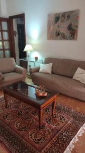 a living room with a couch and a coffee table at Appartamento Ida vacanza mare in Policoro