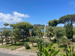 a view of a park with trees and a street at Vista Lago in Bacoli