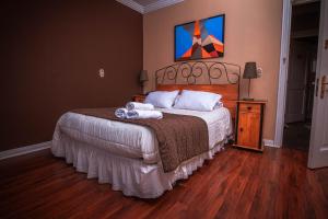Cama ou camas em um quarto em Hotel Inti Kuyen Plaza