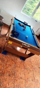 a pool table sitting on top of a table at Cabana Muntelui in Cluj-Napoca