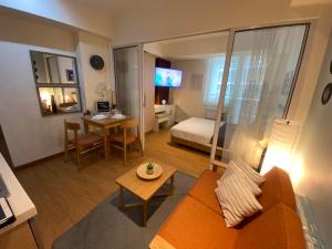 een woonkamer met een bank, een bed en een tafel bij Taylor Swift - inspired Staycation in Azure in Manilla