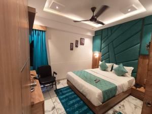 Postel nebo postele na pokoji v ubytování Hotel Prime Villa Gurukul + 1 fotografie