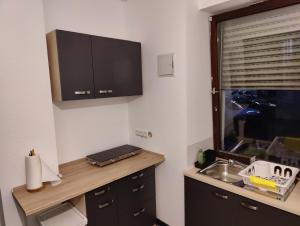 Kuchyň nebo kuchyňský kout v ubytování Bliss - 3 Zimmer, Boho, Arbeitsplatz, Netflix