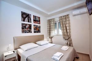 Posteľ alebo postele v izbe v ubytovaní CentRooms Kovac1
