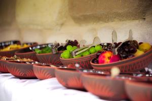 a row of bowls of fruit on a table at Sora Cave Hotel in Goreme