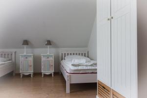 Katil atau katil-katil dalam bilik di Staberhuk Baben - großer sonniger Balkon - XL Wohnung