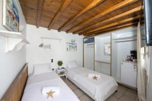 Posteľ alebo postele v izbe v ubytovaní Hibiscus Rosa Mykonos