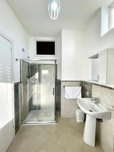 a bathroom with a shower and a sink at B&B Marconi in Ricadi +19 photos