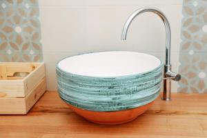 a bowl sink with a faucet on a counter at Casa VersoMare Rooftop in Gagliano del Capo