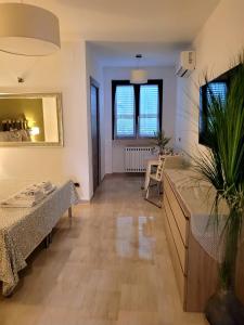 Ένα ή περισσότερα κρεβάτια σε δωμάτιο στο Pompei Suite