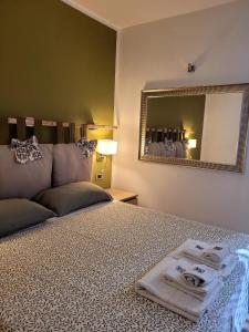 Ένα ή περισσότερα κρεβάτια σε δωμάτιο στο Pompei Suite
