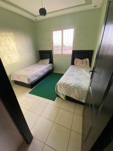 Ein Bett oder Betten in einem Zimmer der Unterkunft Appartement à Marrakech