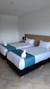 Voodi või voodid majutusasutuse Hotel Royal Cid Bogota toas