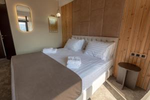Postel nebo postele na pokoji v ubytování Bellevue Boutique Hotel