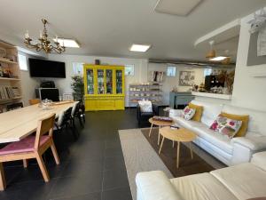 a living room with a couch and a table at Casa Acougo, Sarria in Sarria