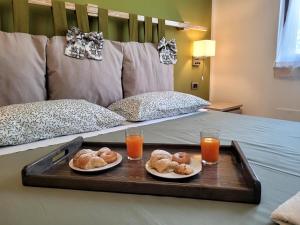 Ένα ή περισσότερα κρεβάτια σε δωμάτιο στο Pompei Suite
