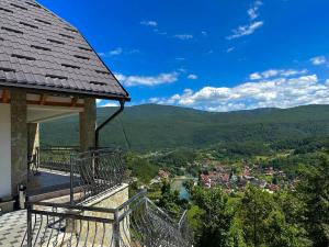 a gazebo with a view of a town and a valley at Villa Ostrovica in Bihać