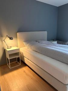 En eller flere senger på et rom på Ny og flott leilighet i Trondheim