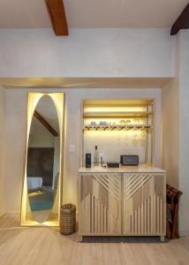 a room with a counter with a mirror at Hotel Shibari - Restaurant & Cenote Club in Tulum
