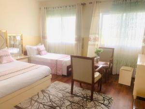 Postel nebo postele na pokoji v ubytování Hôtel Sky blue Mada