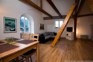 a living room with a couch and a table at Haus Weihertor in Traben-Trarbach