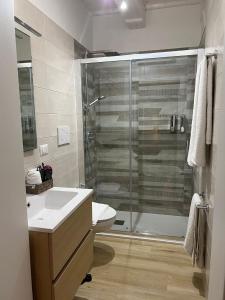 a bathroom with a shower and a toilet and a sink at La Esperanza De Santa Rita in Bari