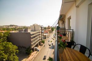 a balcony with a view of a city street at Acropolis View - 500m Metro - At Historical Center in Athens