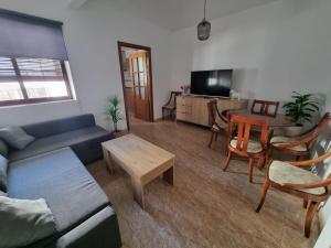 a living room with a couch and a table at AT SAN PEDRO 1 in Olivenza