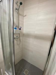 a shower with a glass door in a bathroom at Holiday Setúbal Loft in Setúbal