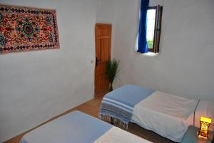 Postel nebo postele na pokoji v ubytování Cortijo Los Maximos