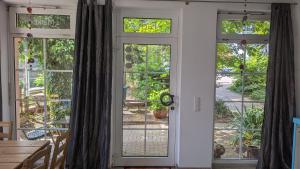 an open door to a patio with windows at Ferienwohnung Kaminfeuer in Eilenburg