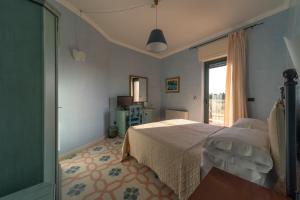 Llit o llits en una habitació de Villa Rosa Antico Dimora Storica
