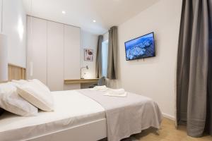 Postel nebo postele na pokoji v ubytování Top Floor Luxury Rooms