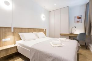 Postel nebo postele na pokoji v ubytování Top Floor Luxury Rooms