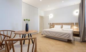 Postel nebo postele na pokoji v ubytování Top Floor Luxury Rooms