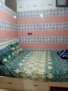 a bedroom with a bed with an american flag at taghazout agadir appartement familiale in Taghazout