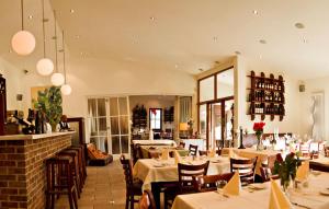 a dining room with tables and chairs in a restaurant at Studio Apartment Santana Habaneras - 18 at Beach with Garage, Pool and Lift in Torrevieja