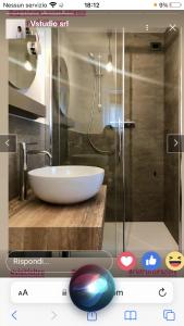 a bathroom with a glass shower with a white sink at Agriturismo Quinta Essenza in Casoni Zanolla