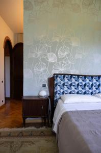 Giường trong phòng chung tại Villa la Ginestra - Charming Country Rooms