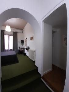 Un pat sau paturi într-o cameră la B&B Domus Enna